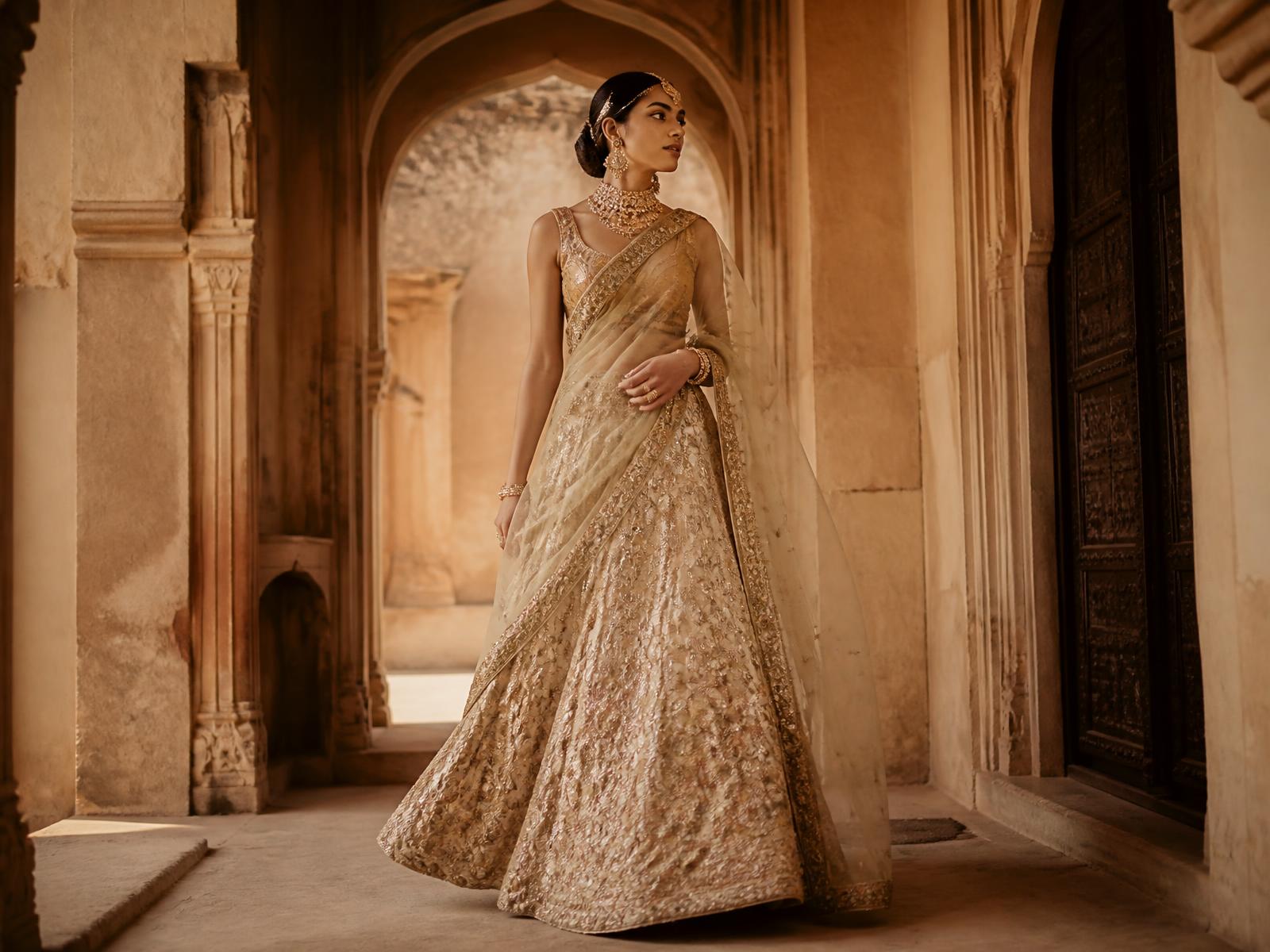 Bridal lehenga in an arched corridor